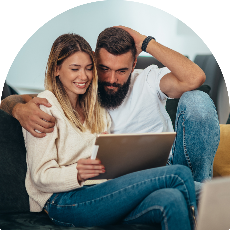 Homeowners reviewing a Moldnosis mold inspection report at home